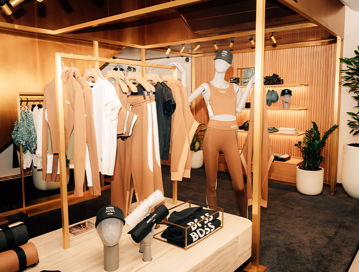 Female HUGO-BOSS products displayed on shelves at BOSS AURA (photo)