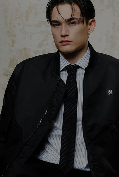 Male model in black HUGO jacket and tie (photo)